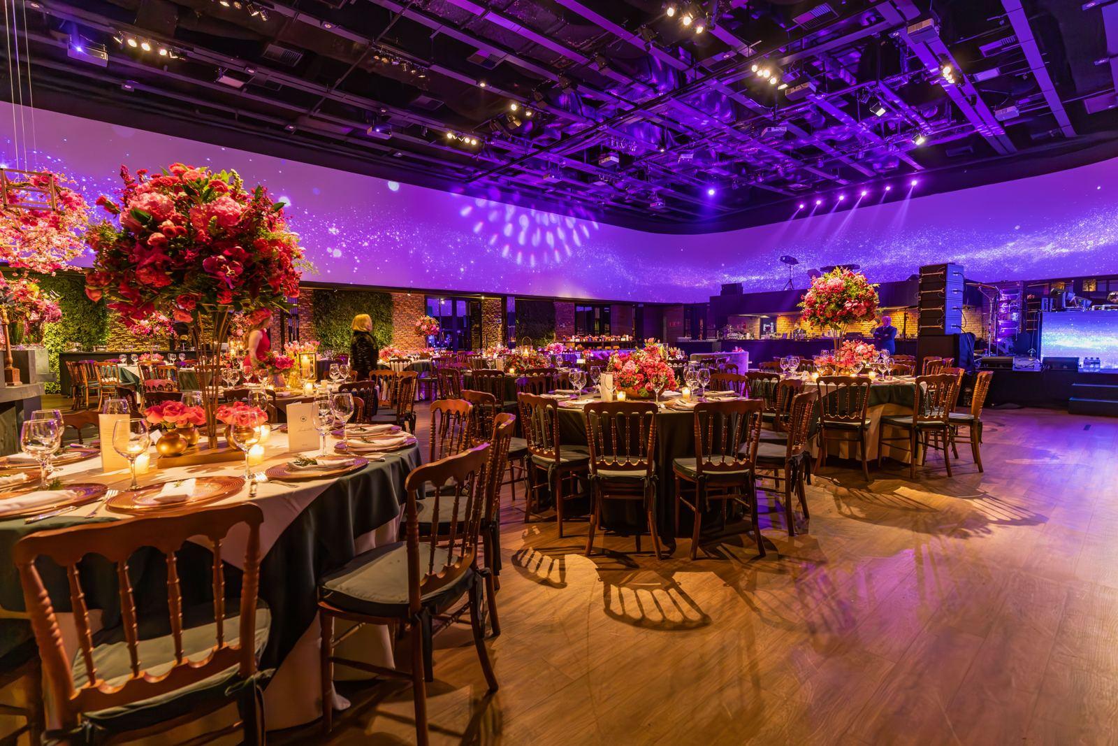 A gala ballroom set for an evening event