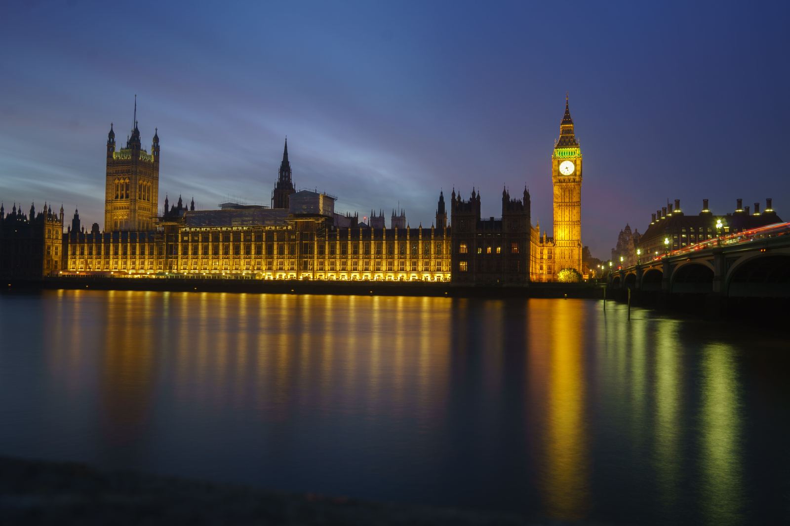 The Houses of Parliament and Westminster Bridge lit at dusk