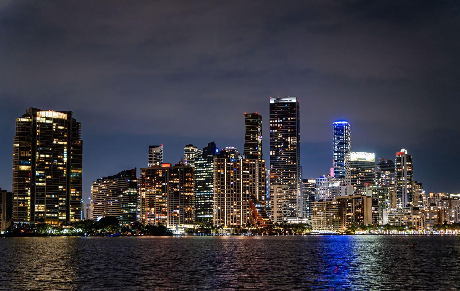 Miami skyline at night reflected in Biscayne Bay