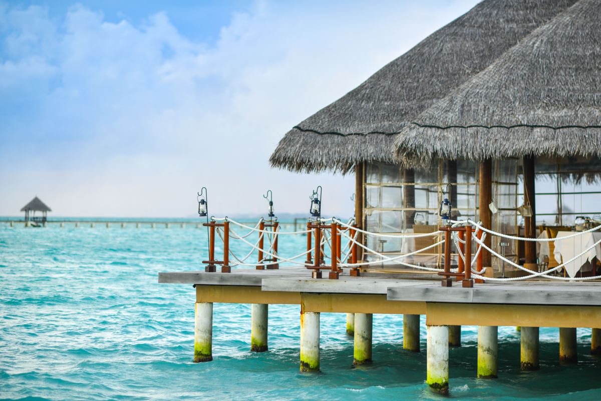 Overwater villas above a turquoise lagoon